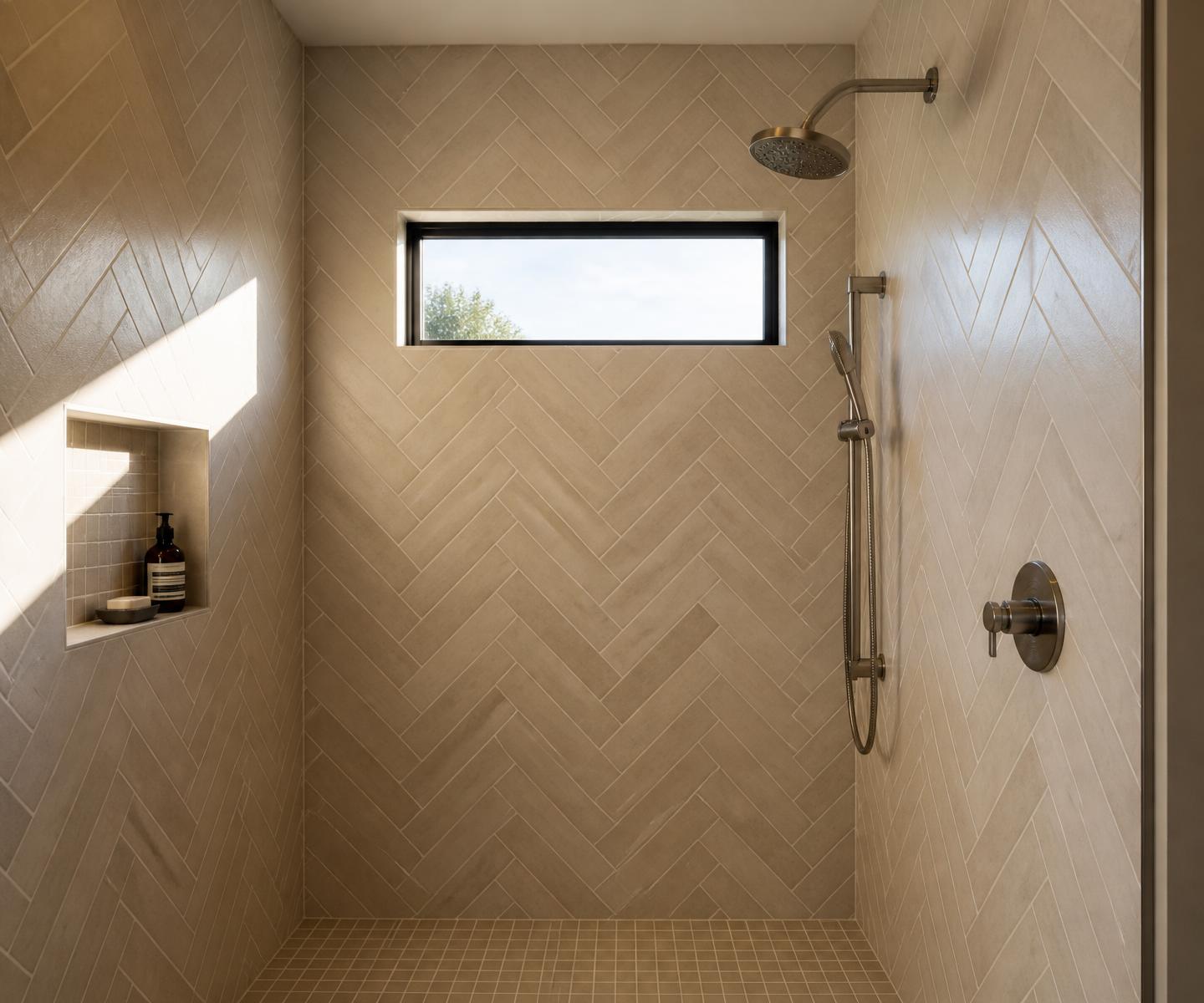 Herringbone porcelain tile walk-in shower installed by DSW Flooring in Lubbock, Texas